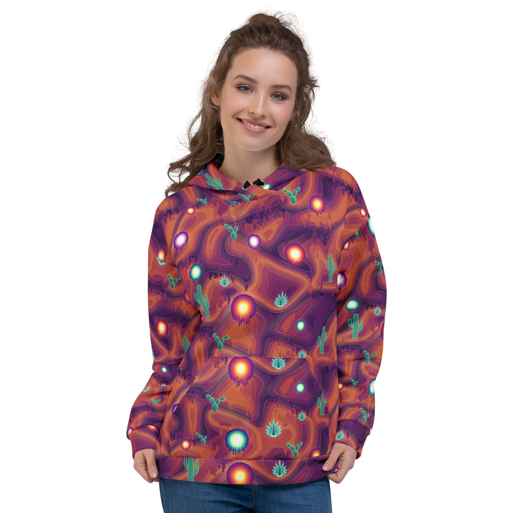 Melting Canyon all-over print hoodie on a female model, original art by AuraCanvas